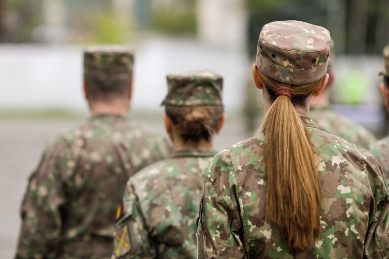 Romanian female land forces soldier take part at a public ceremony.